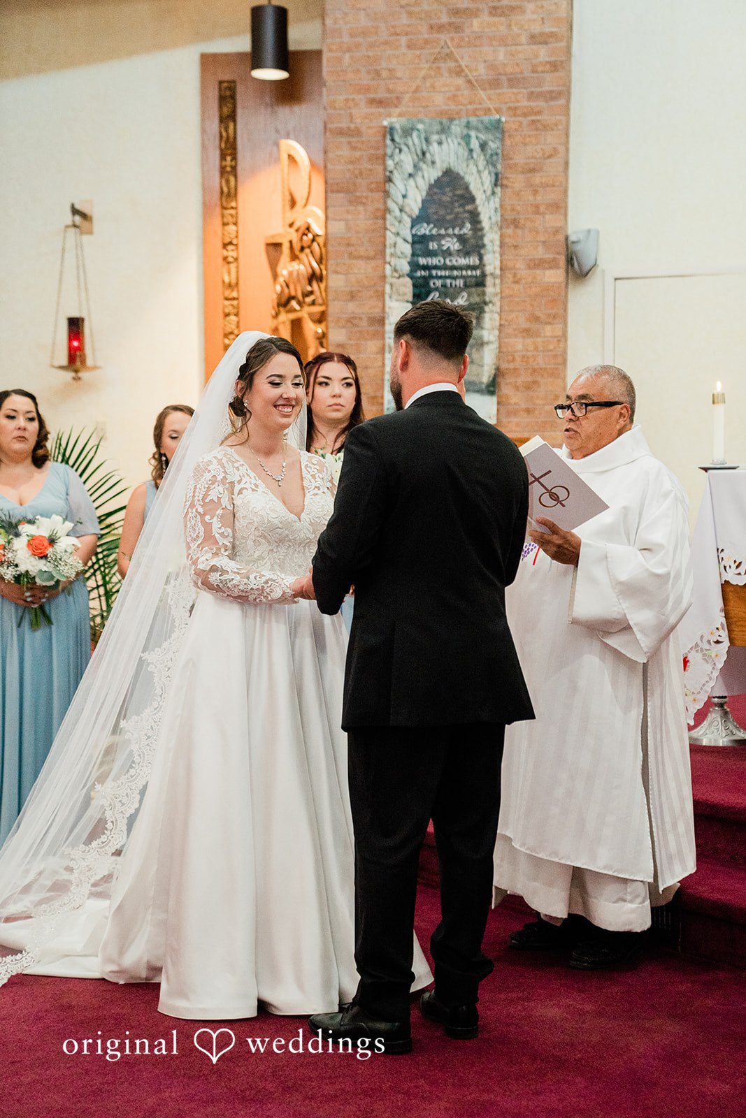 Christina + Quinton The priest blesses the union