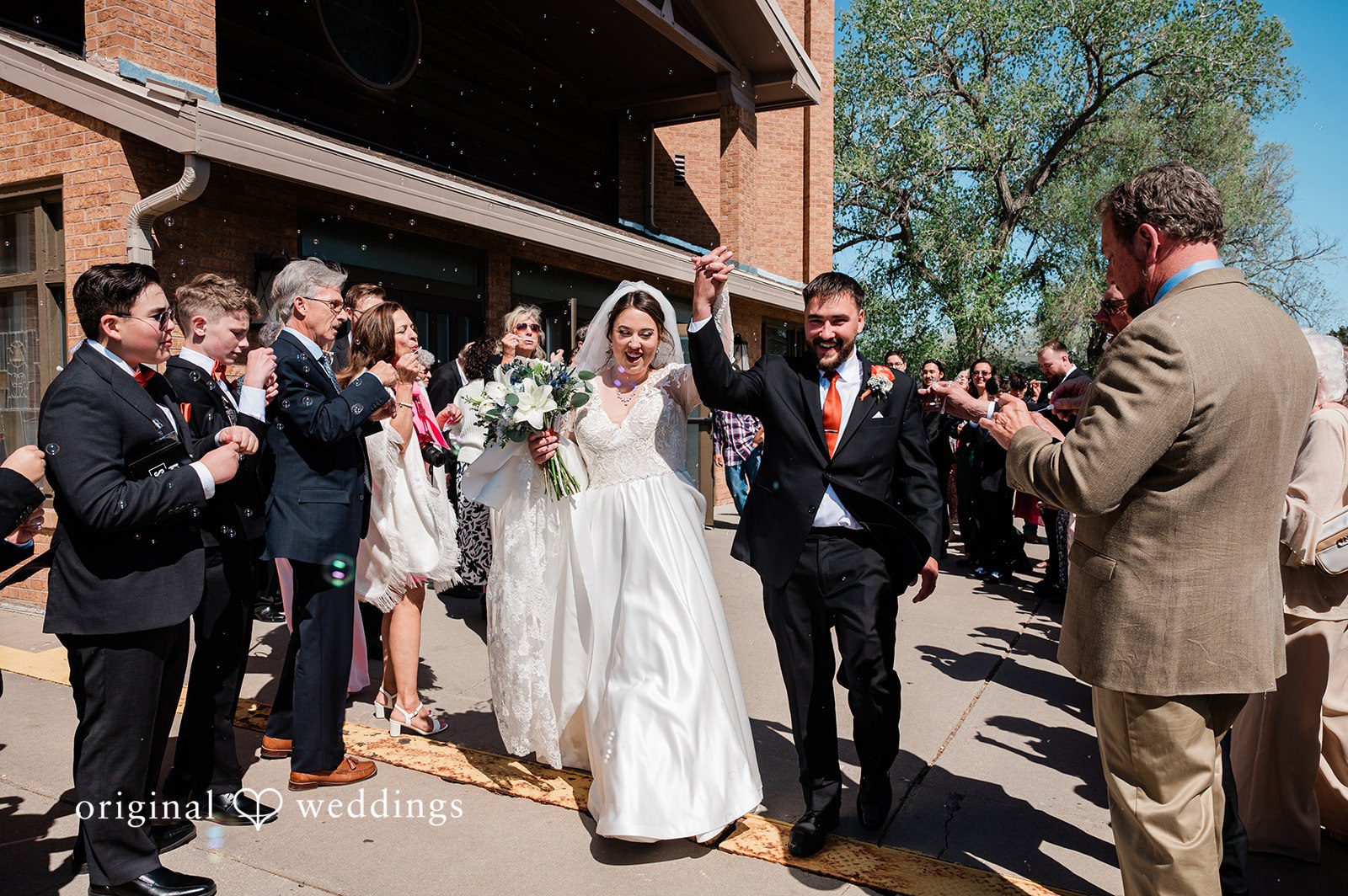 Christina + Quinton A joyful portrait of the couple after their wedding ceremony
