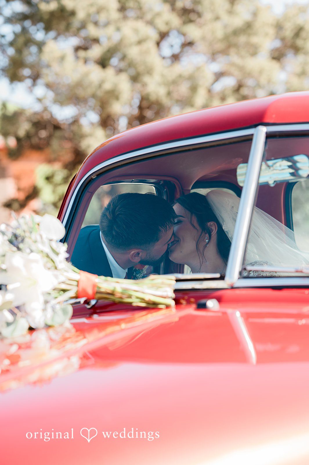 Christina + Quinton The couple shares a kiss in their car