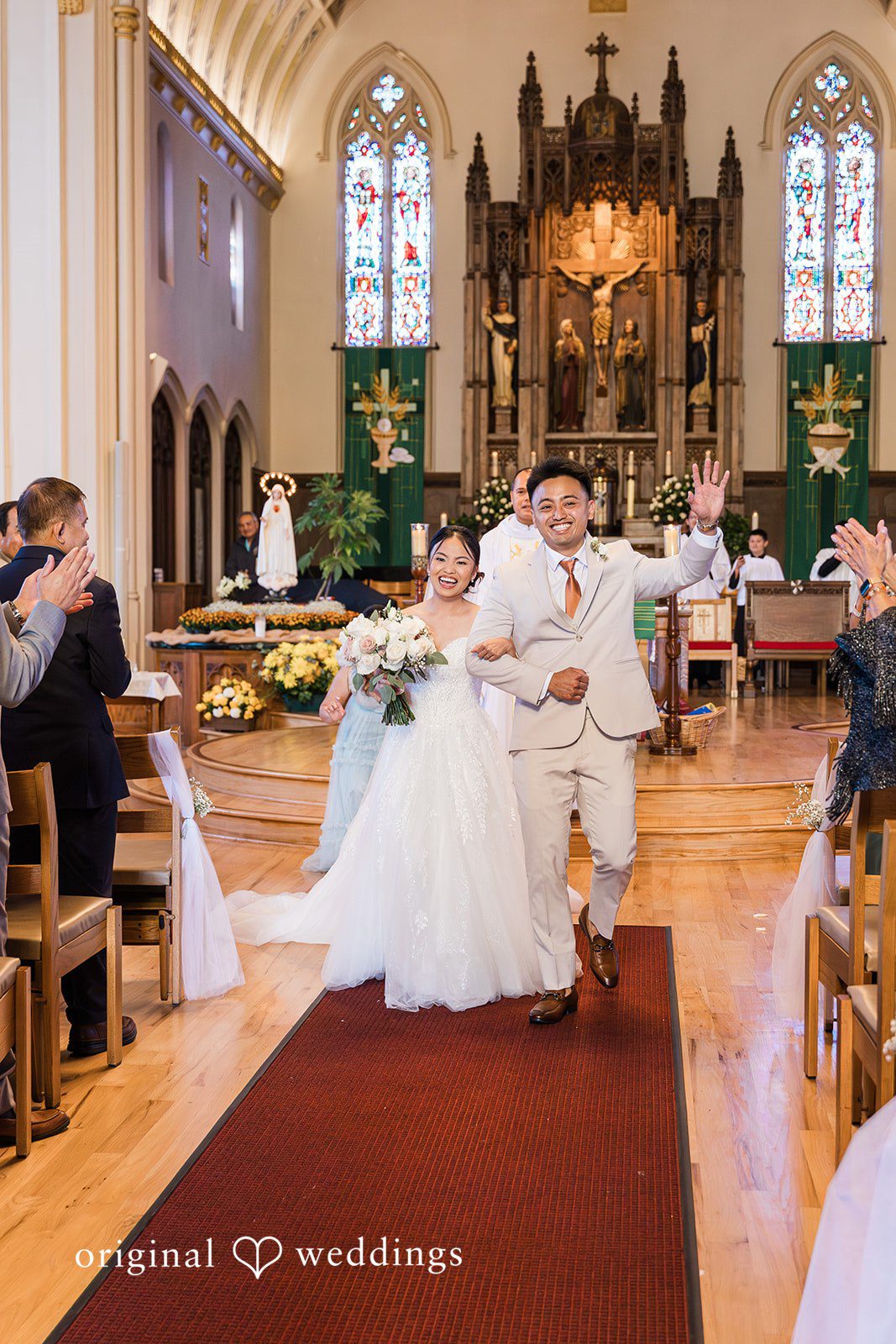 Charize Giann + Mark Shou Bride and groom walking together after ceremony at Palm Event Center