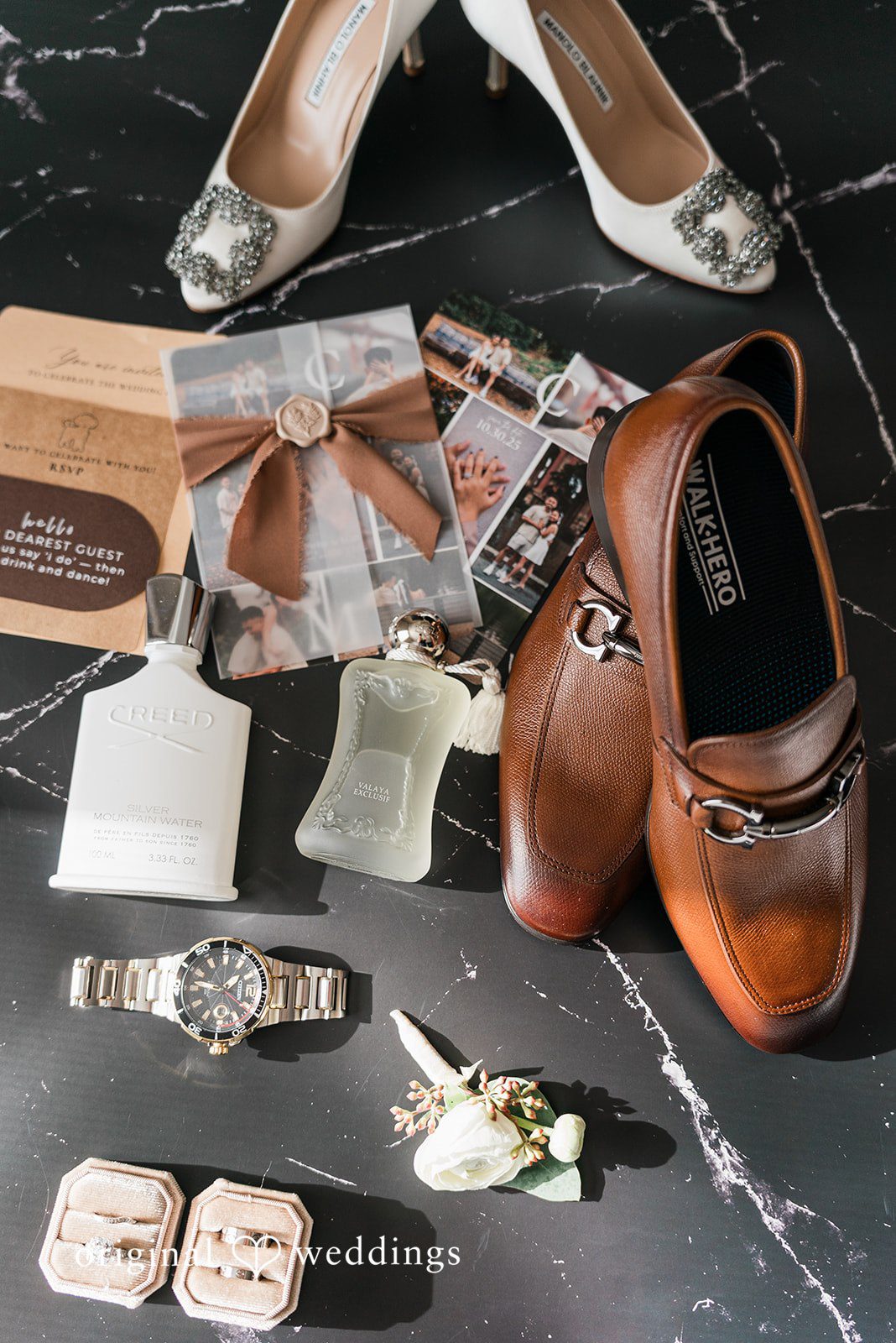 Charize Giann + Mark Shou Elegant groom wedding detail flat lay with brown dress shoes, luxury cologne, wedding rings, watch, and invitation suite captured by San Francisco wedding photographers from Original Weddings