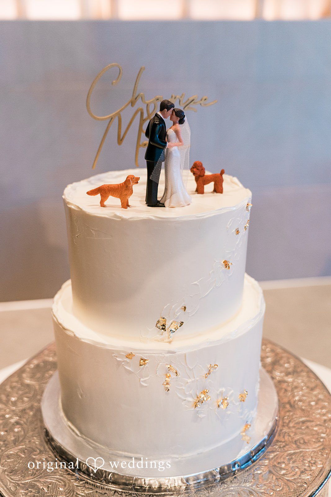 Charize Giann + Mark Shou Elegant wedding cake with gold leaf details and custom bride and groom topper