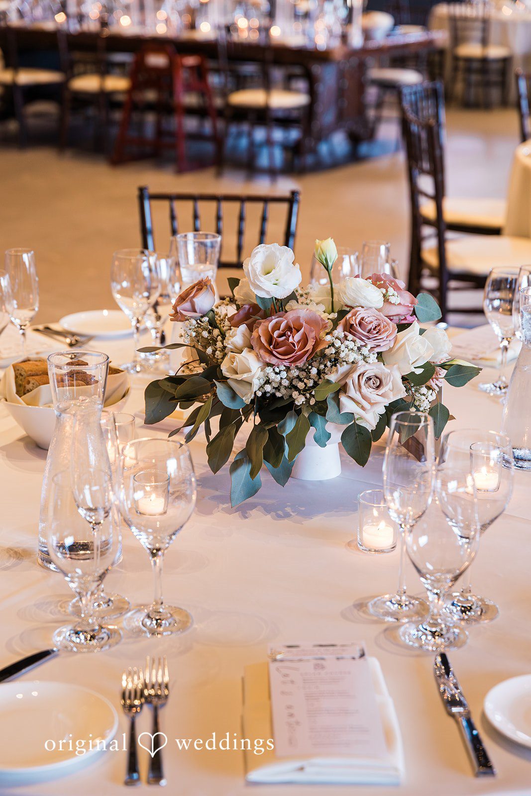 Charize Giann + Mark Shou Elegant wedding reception table setup with floral centerpiece at Palm Event Center