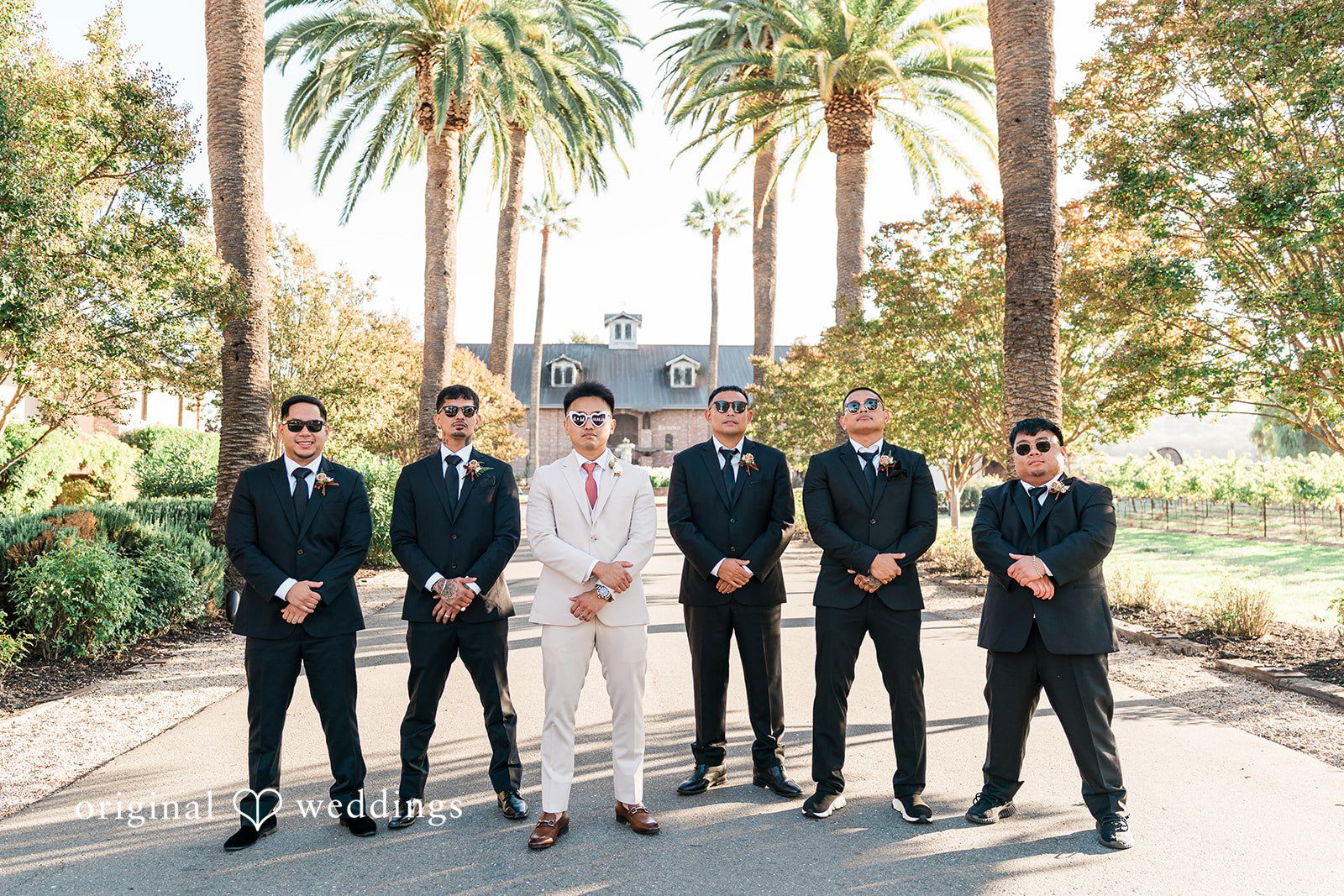 Charize Giann + Mark Shou Groom with groomsmen posing together at Palm Event Center