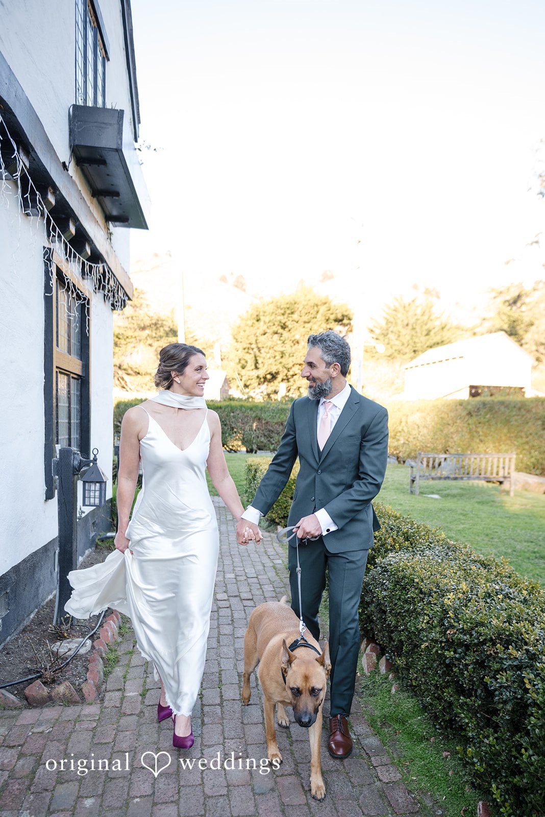 The couple takes a walk with their pup