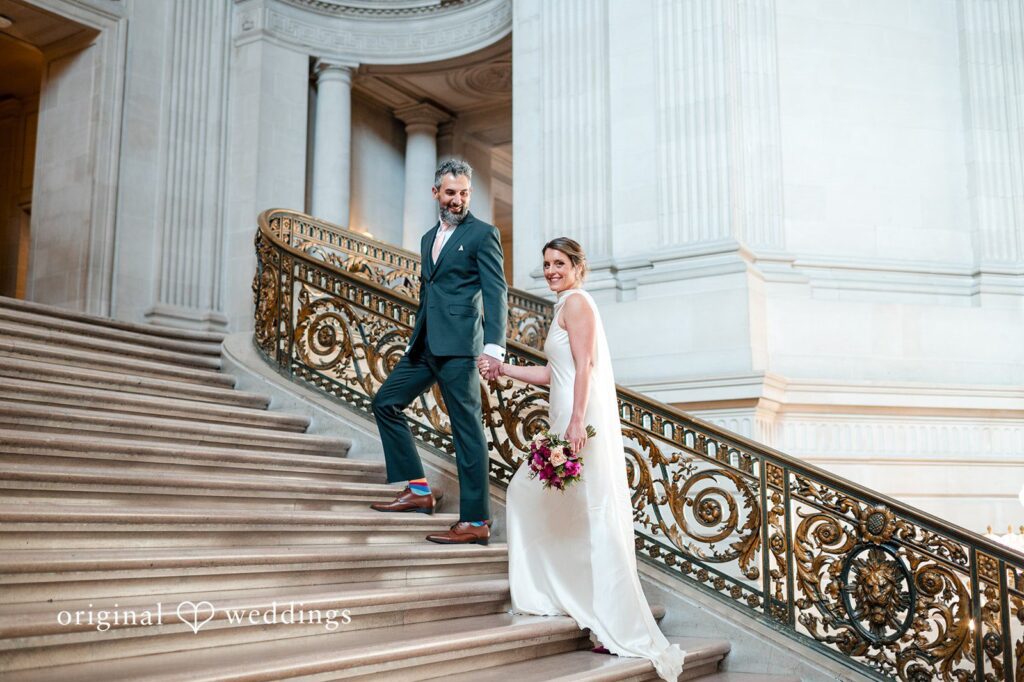 Our San Francisco wedding photographers at Original Weddings captured a stunning portrait of the couple by the City Hall's massive stairs before they headed to the Pelican Inn