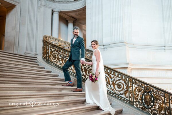 Our San Francisco wedding photographers at Original Weddings captured a stunning portrait of the couple by the City Hall's massive stairs before they headed to the Pelican Inn