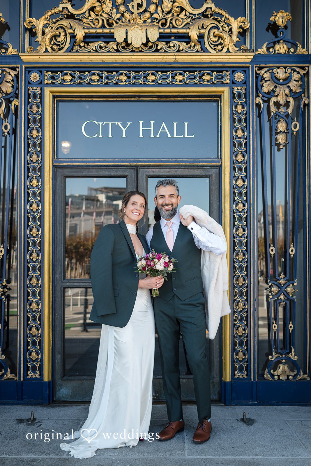 Our San Francisco wedding photographers captured a stunning portrait of the couple in front of the City Hall