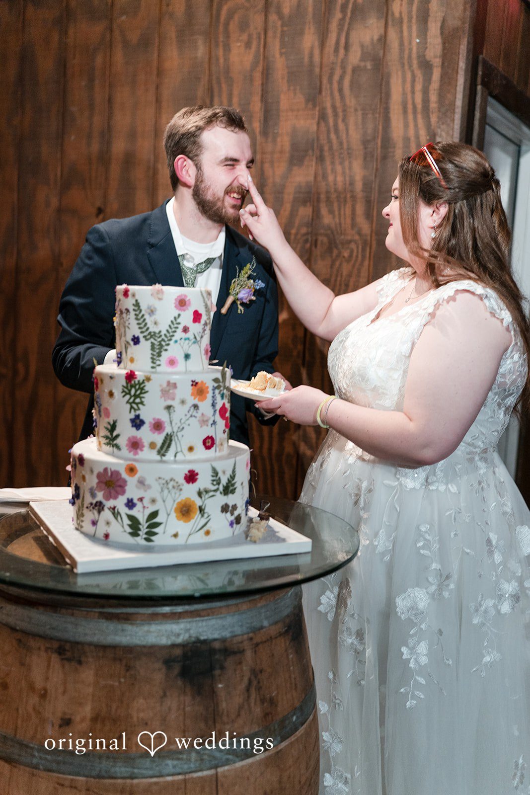 Bride feeding cake to groom at Perona Farms