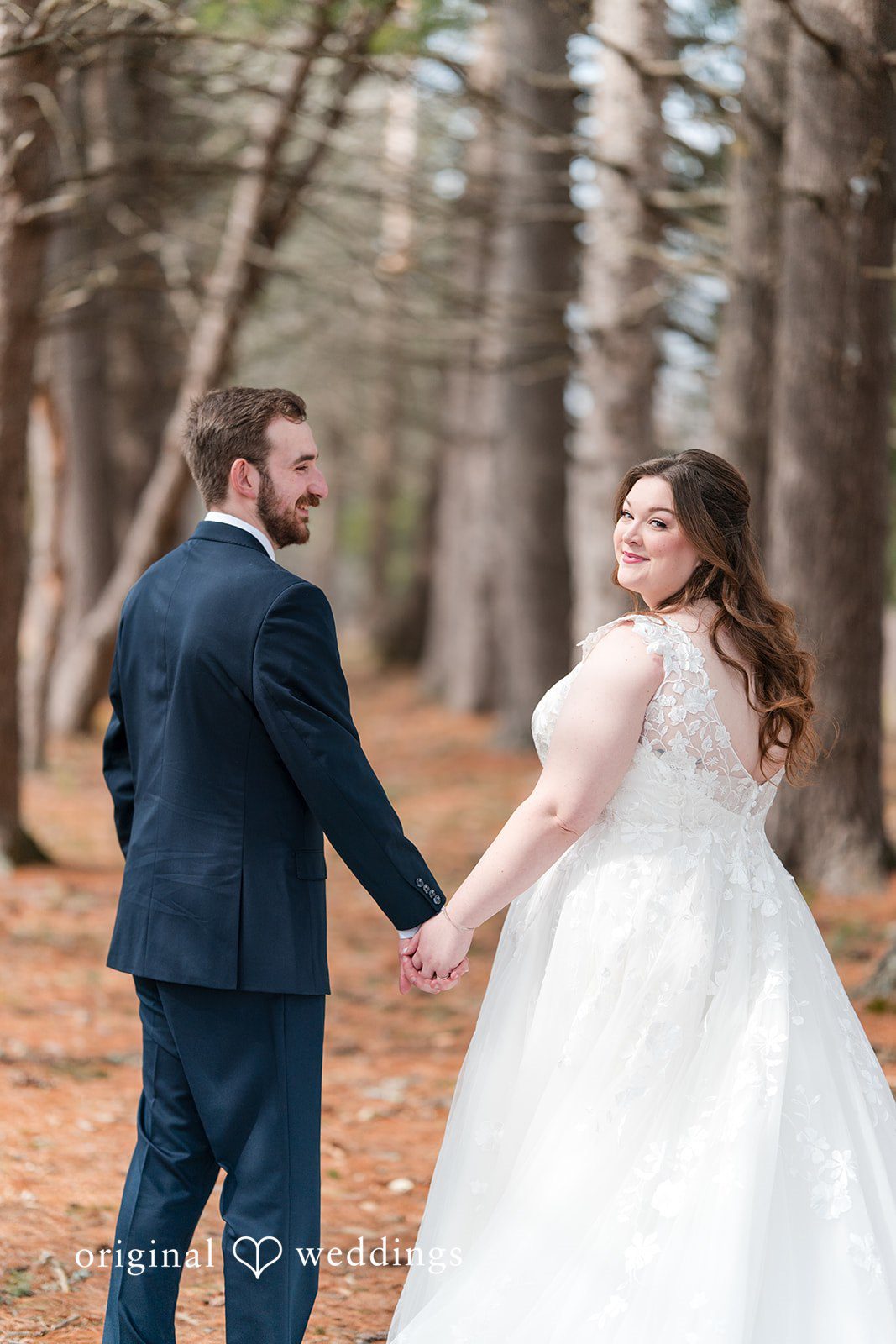 Newlywed couple walking together at Perona Farms