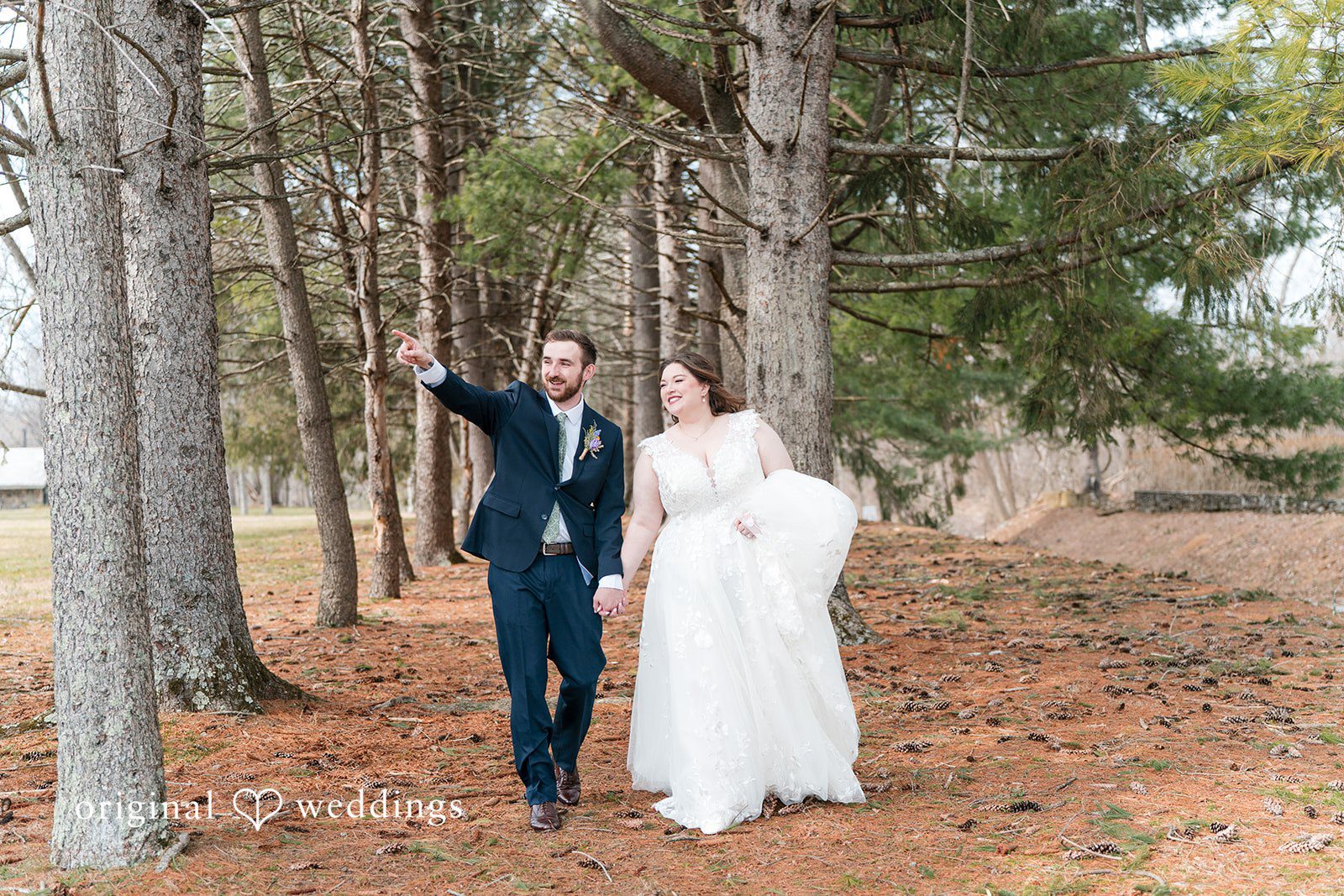 Bride and groom holding hands at Perona Farms
