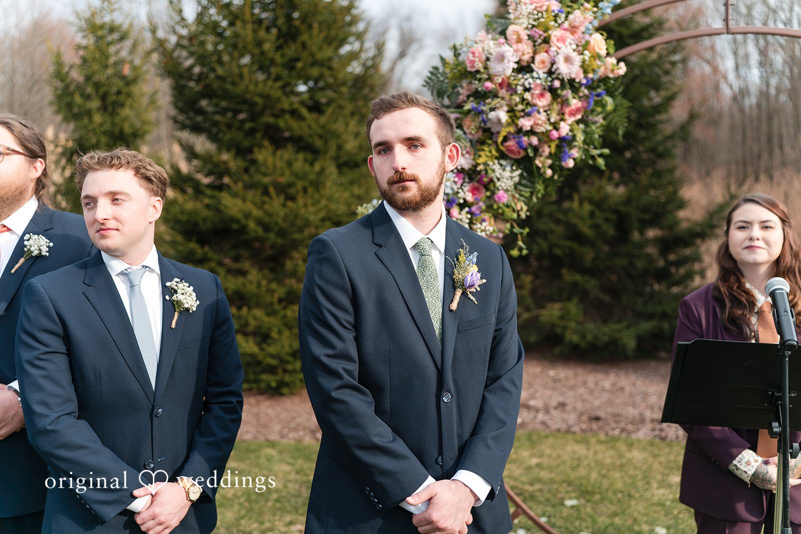 Groom waiting during wedding ceremony at Perona Farms