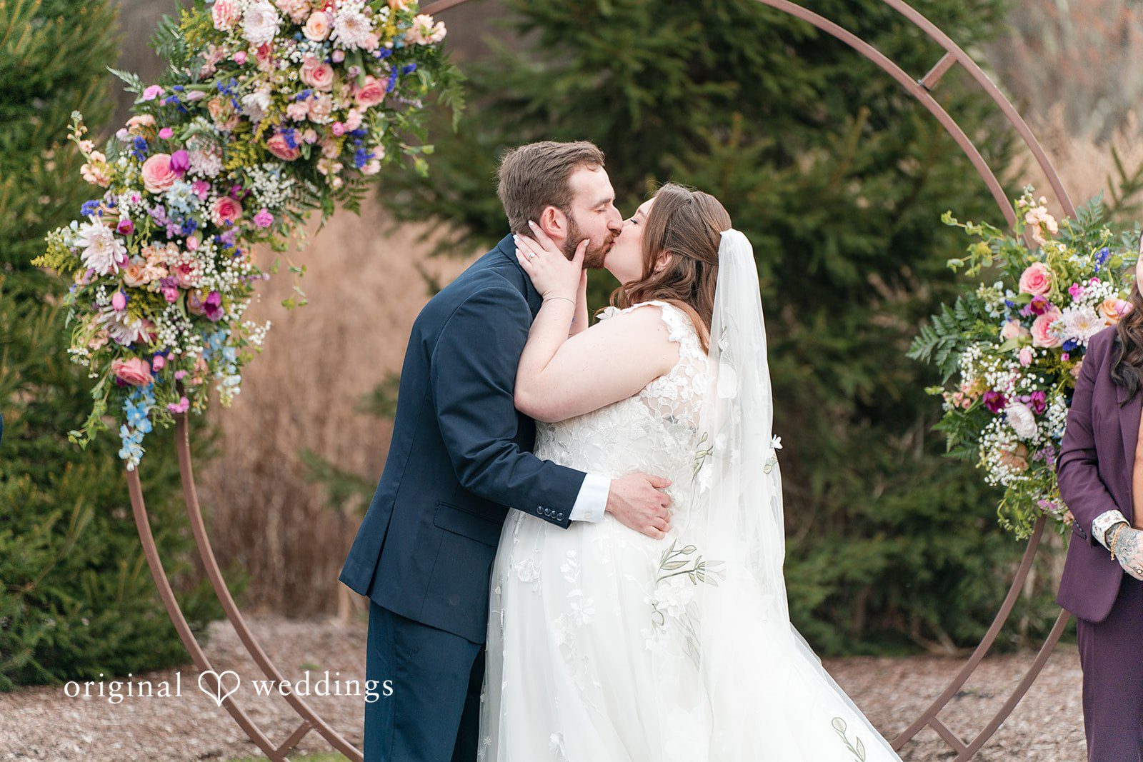 Couple sharing their first kiss at Perona Farms
