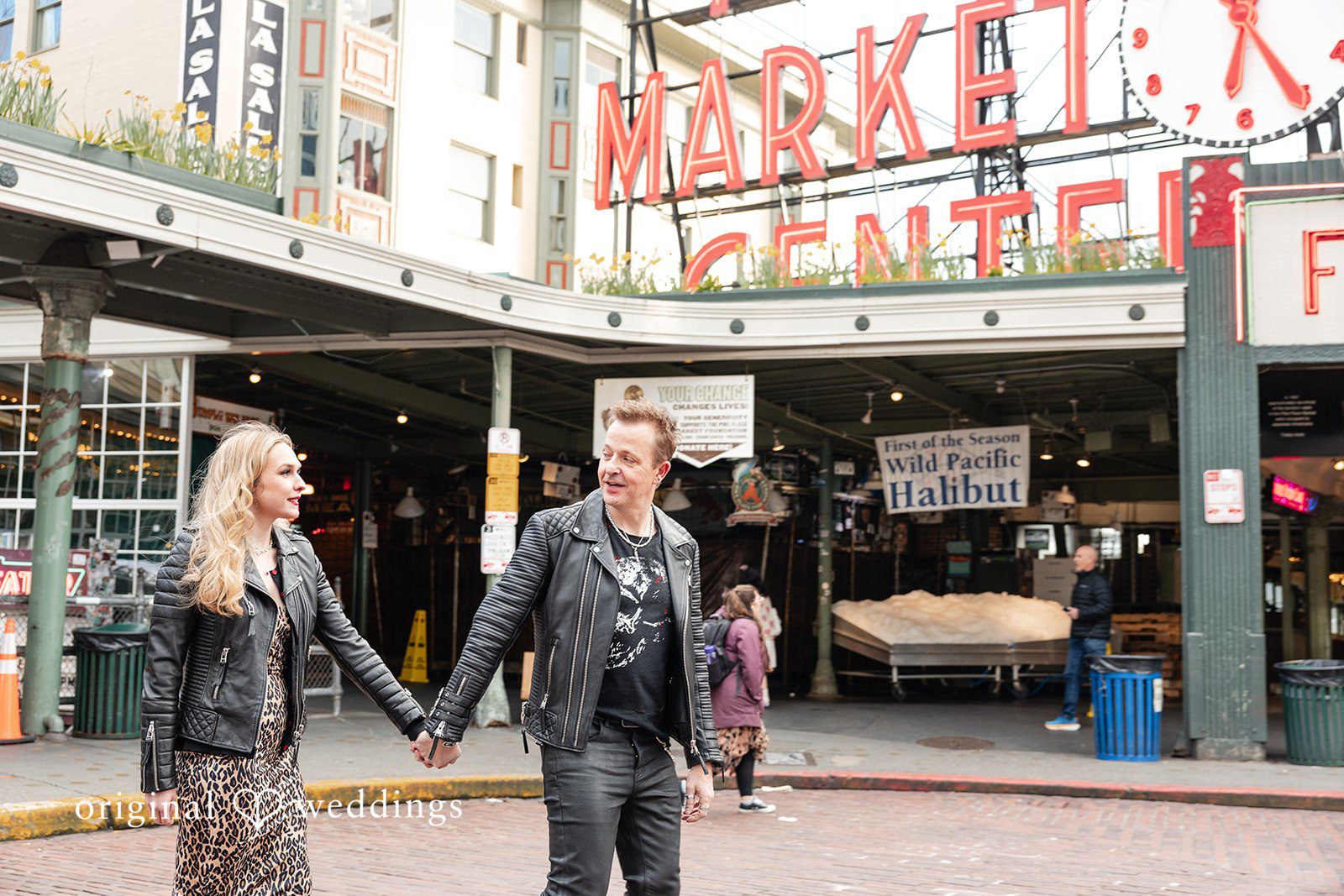 Lovely couple walking and looking at each other at Pike Place Market