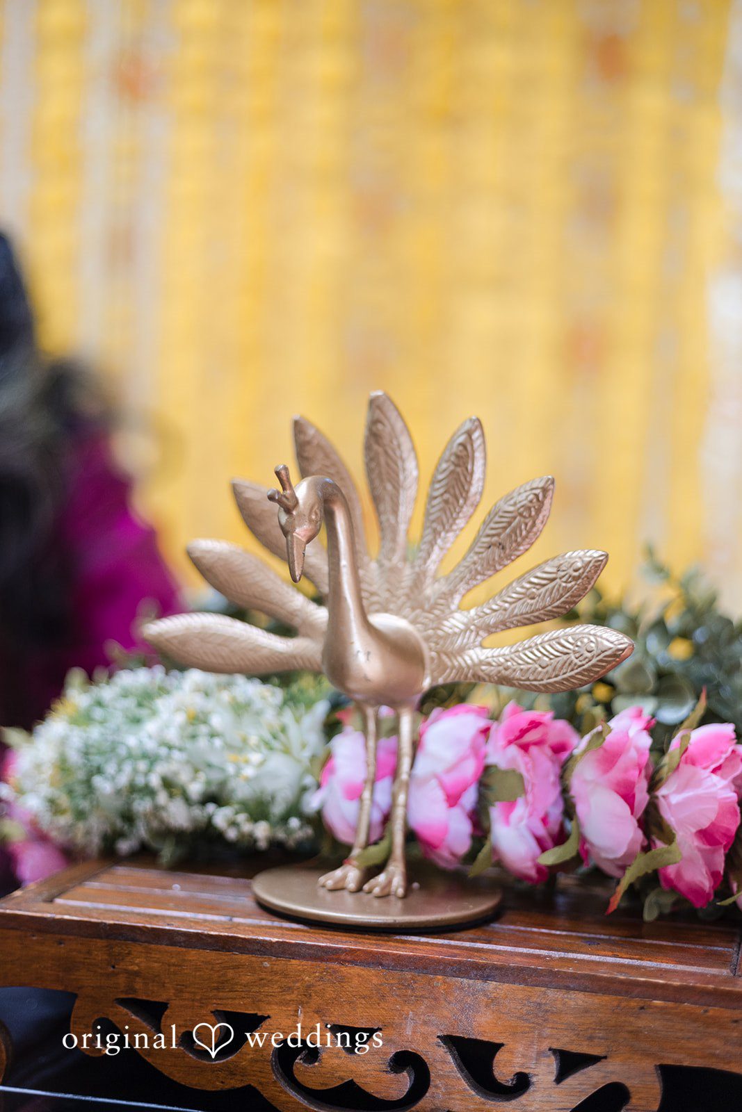 Taylor + Yash Elegant engagement decor with peacock centerpiece