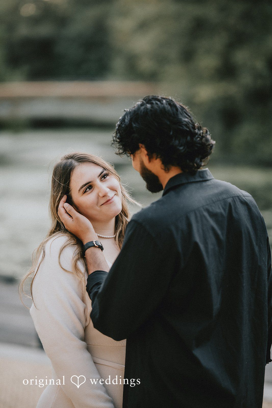 Romantic picture of couple looking at each other at Prospect Park