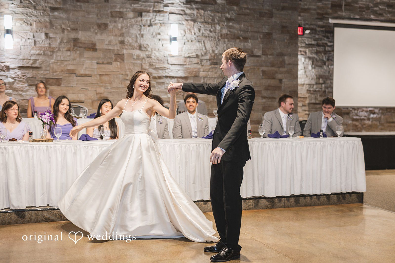 Samantha + Ryan Groom twirling the bride on the dance floor at the reception