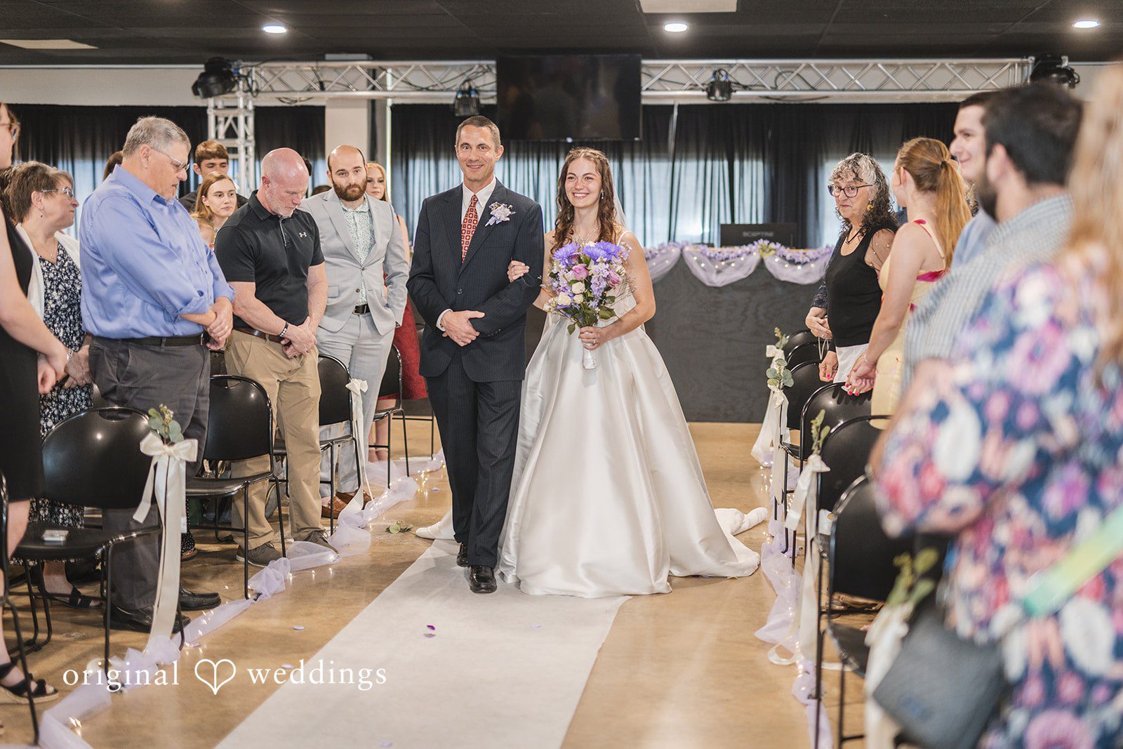 Samantha + Ryan Bride walking with her father toward the ceremony area