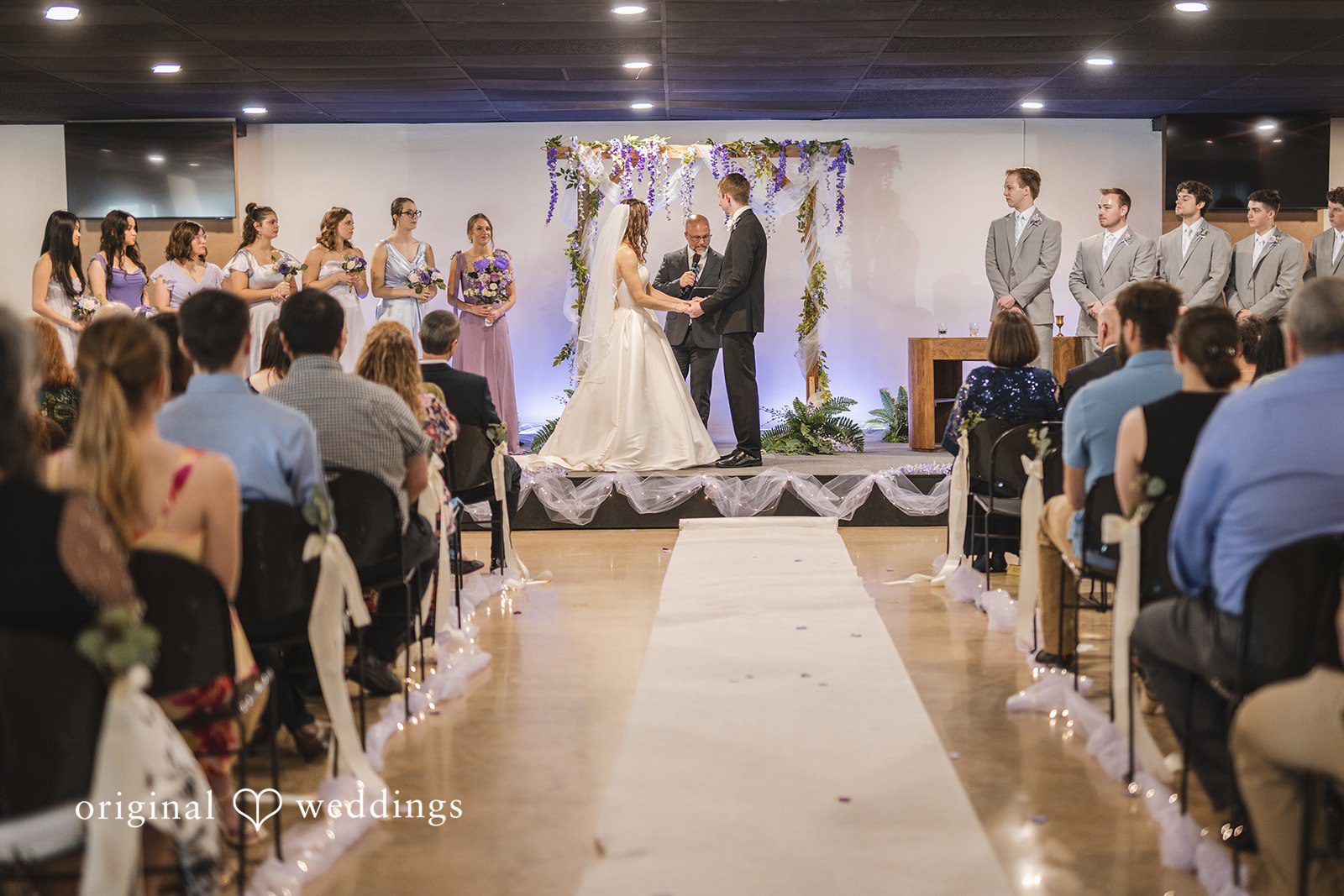Samantha + Ryan Couple posing with guests at the ceremony venue