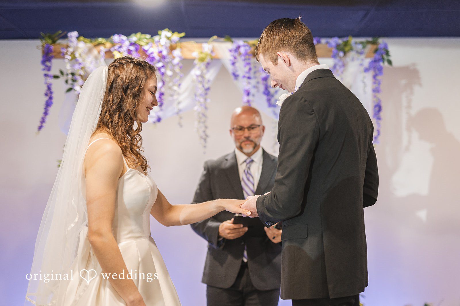 Samantha + Ryan Groom placing the wedding ring on the bride’s finger during the ceremony