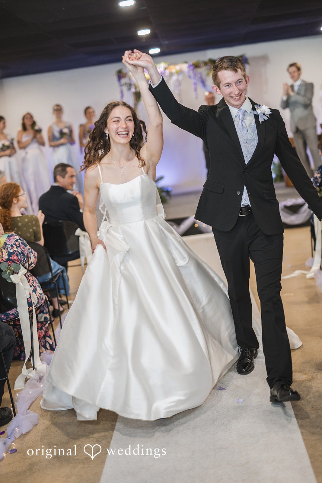 Samantha + Ryan Bride and groom walking away from the ceremony together