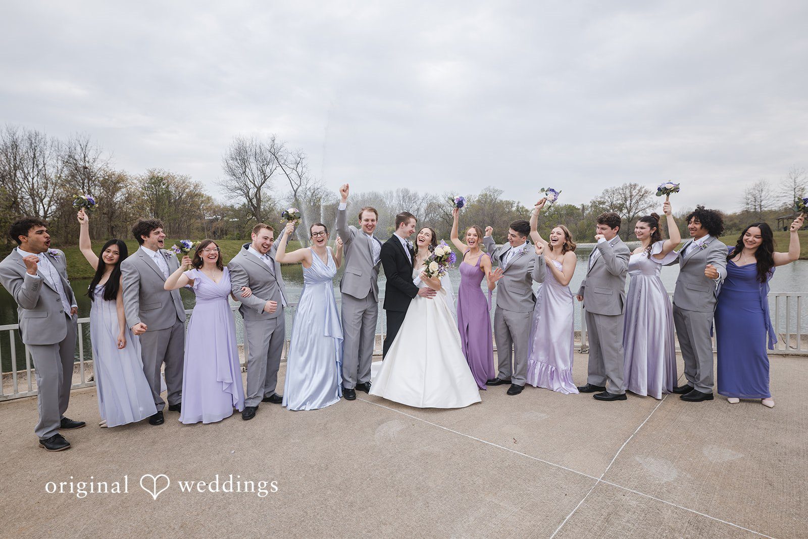 Samantha + Ryan Bride and groom posing with bridesmaids and groomsmen together