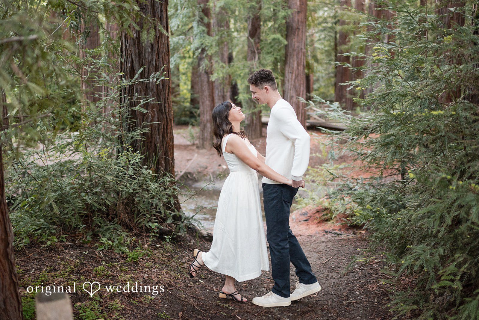 Gabriela + Jack A fun portrait of the couple at their engagement venue