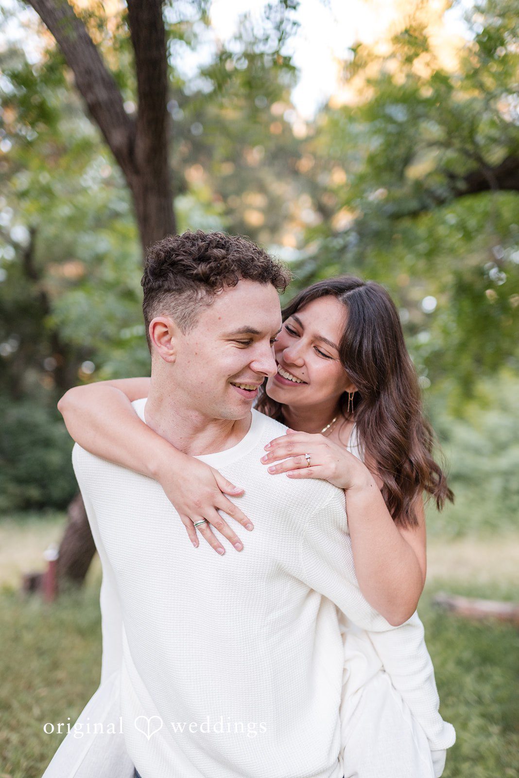 Gabriela + Jack The couple plays piggy-back