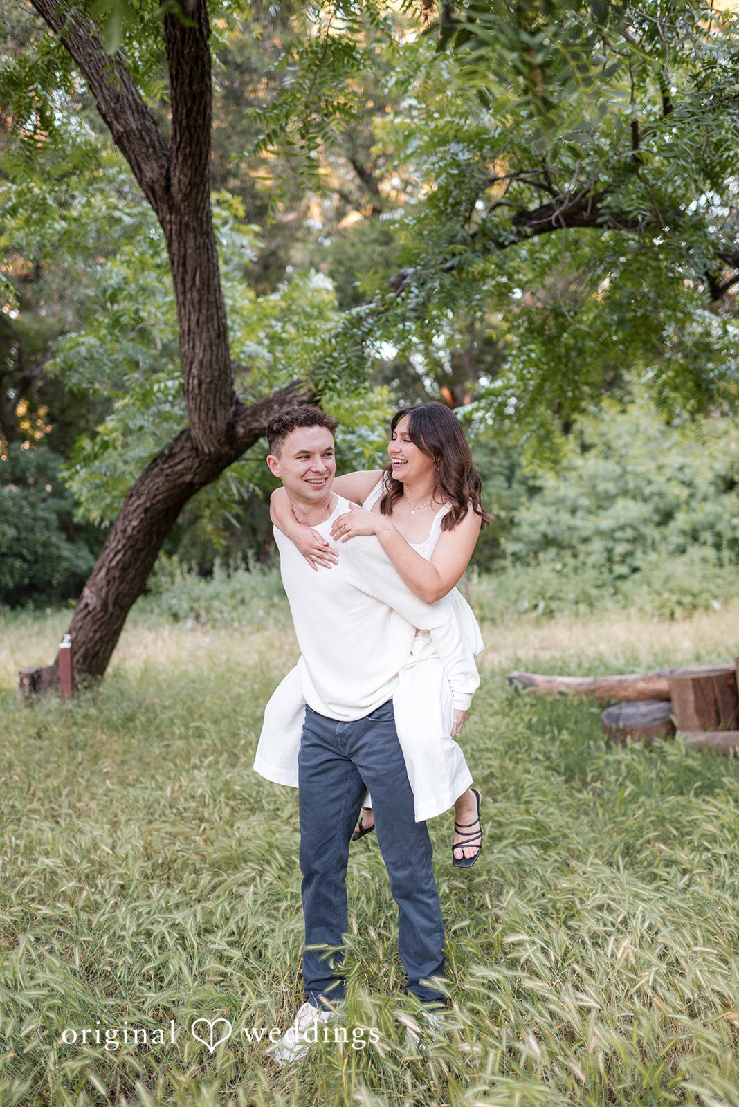 Gabriela + Jack The couple plays piggyback at the venue