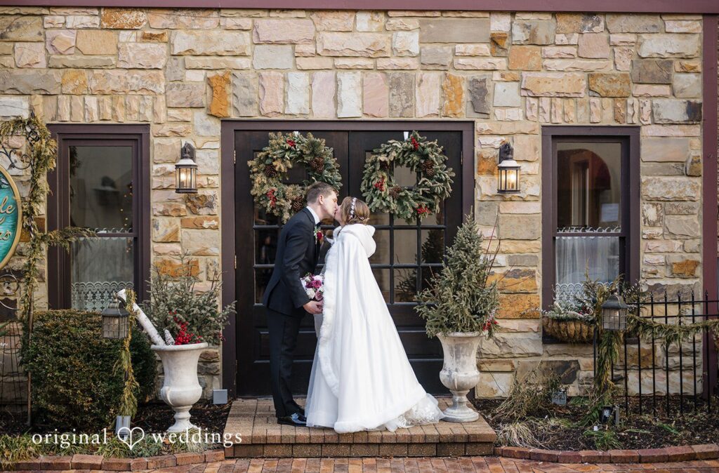 Bride and groom portrait at the entrance of the venue