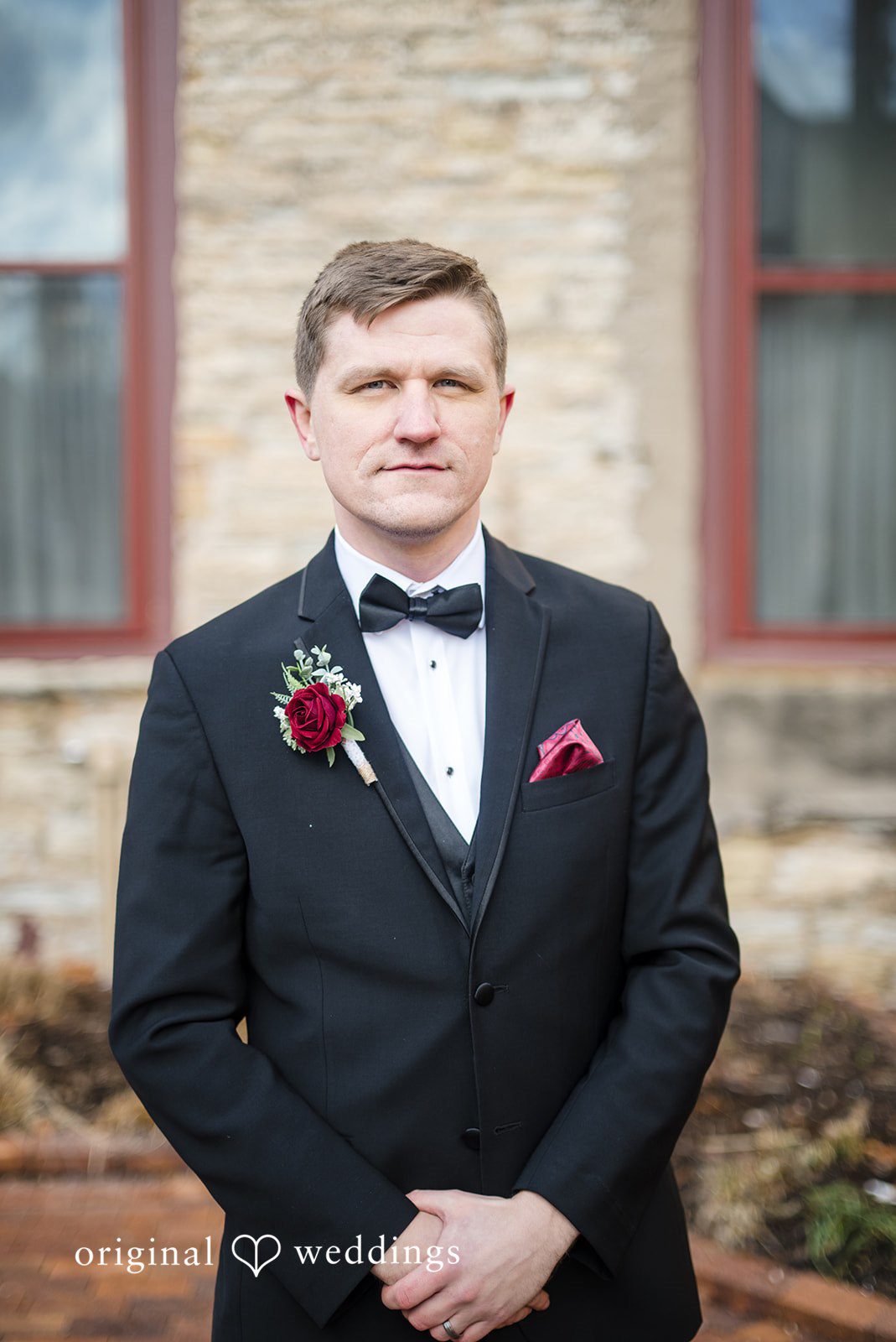 Solo groom portrait outside Riverside Receptions