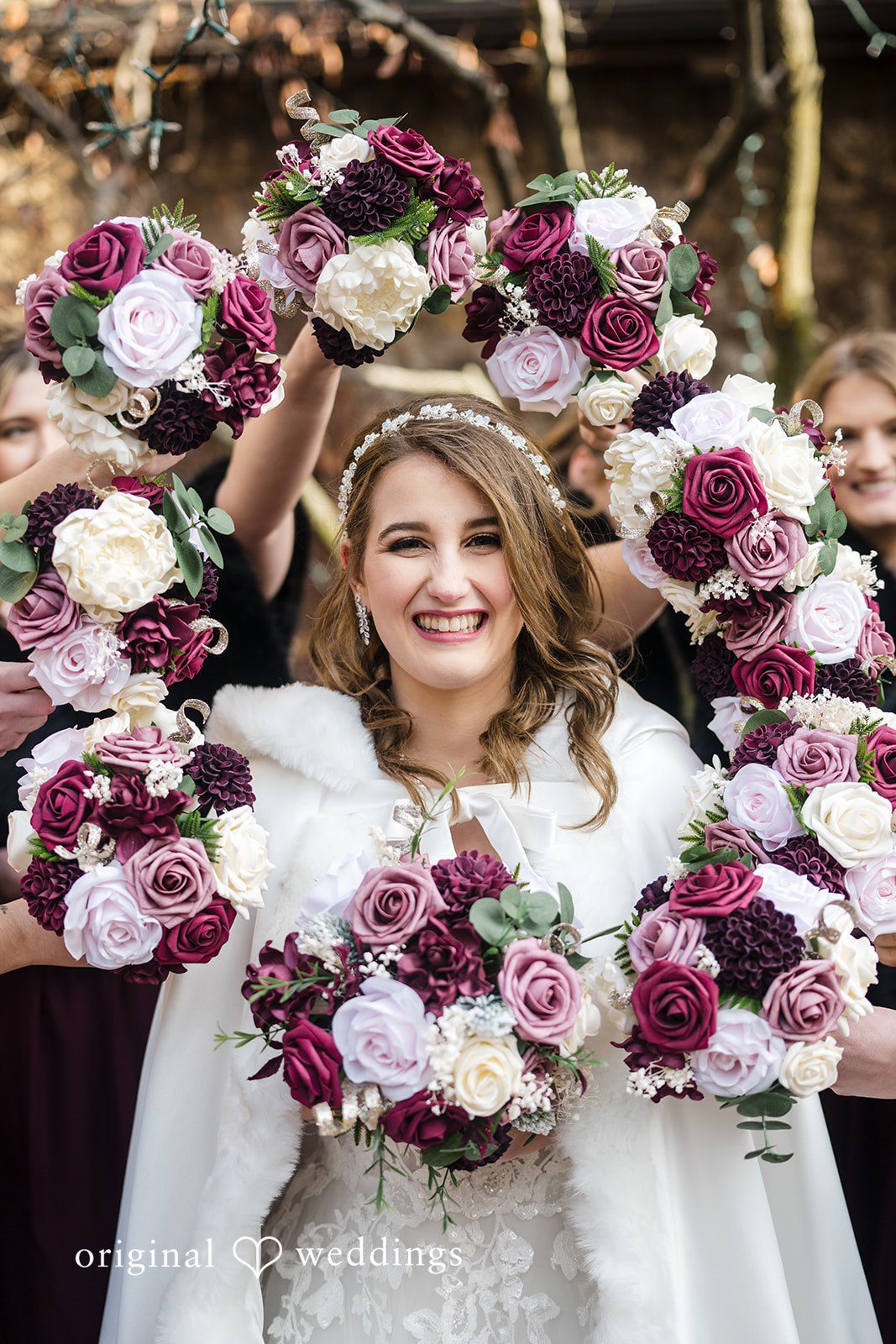 Bride framed by floral bouquet during wedding portraits