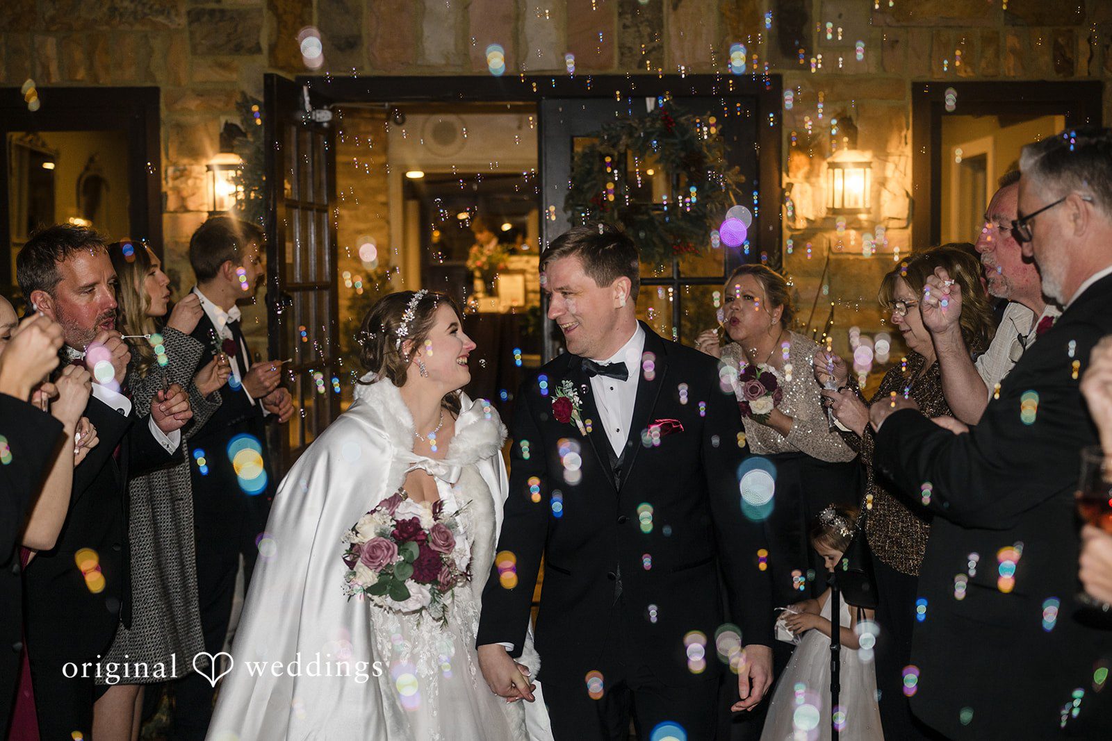 Newlyweds celebrating with guests at the end of the wedding night