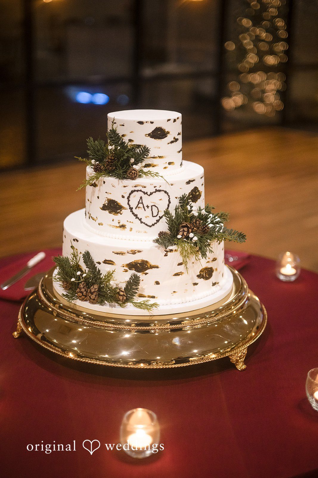 White wedding cake with greenery decoration at the reception