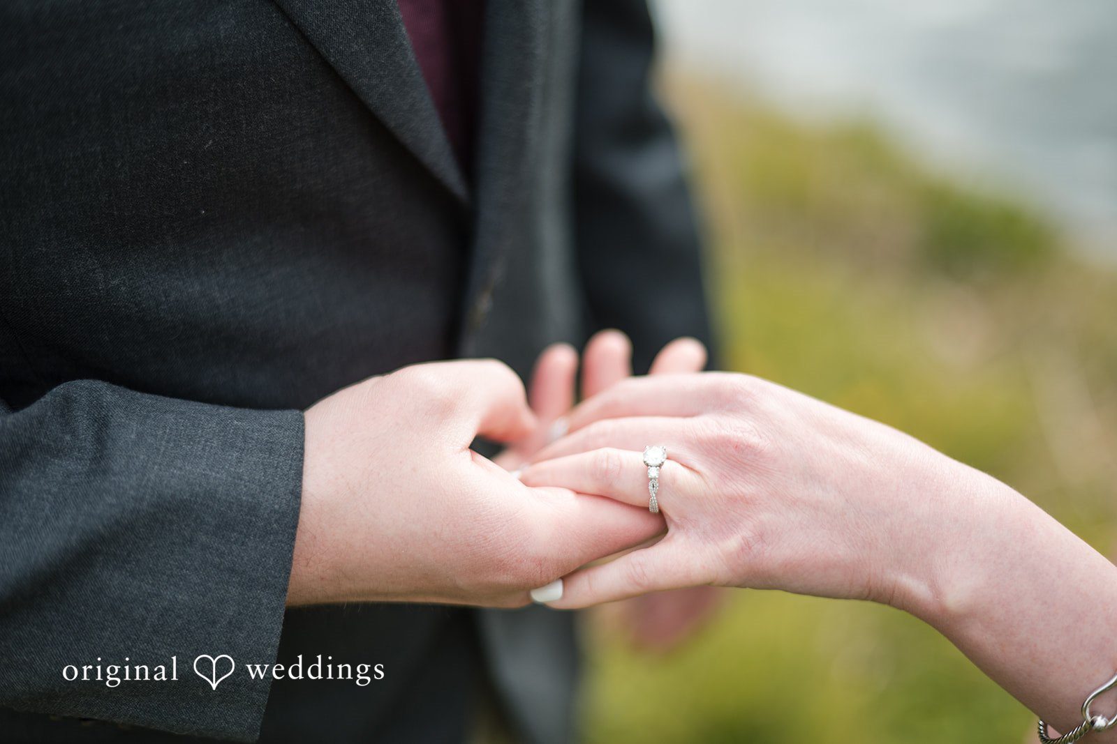 Romantic ring detail shot with couple holding hands at Roger Williams Park
