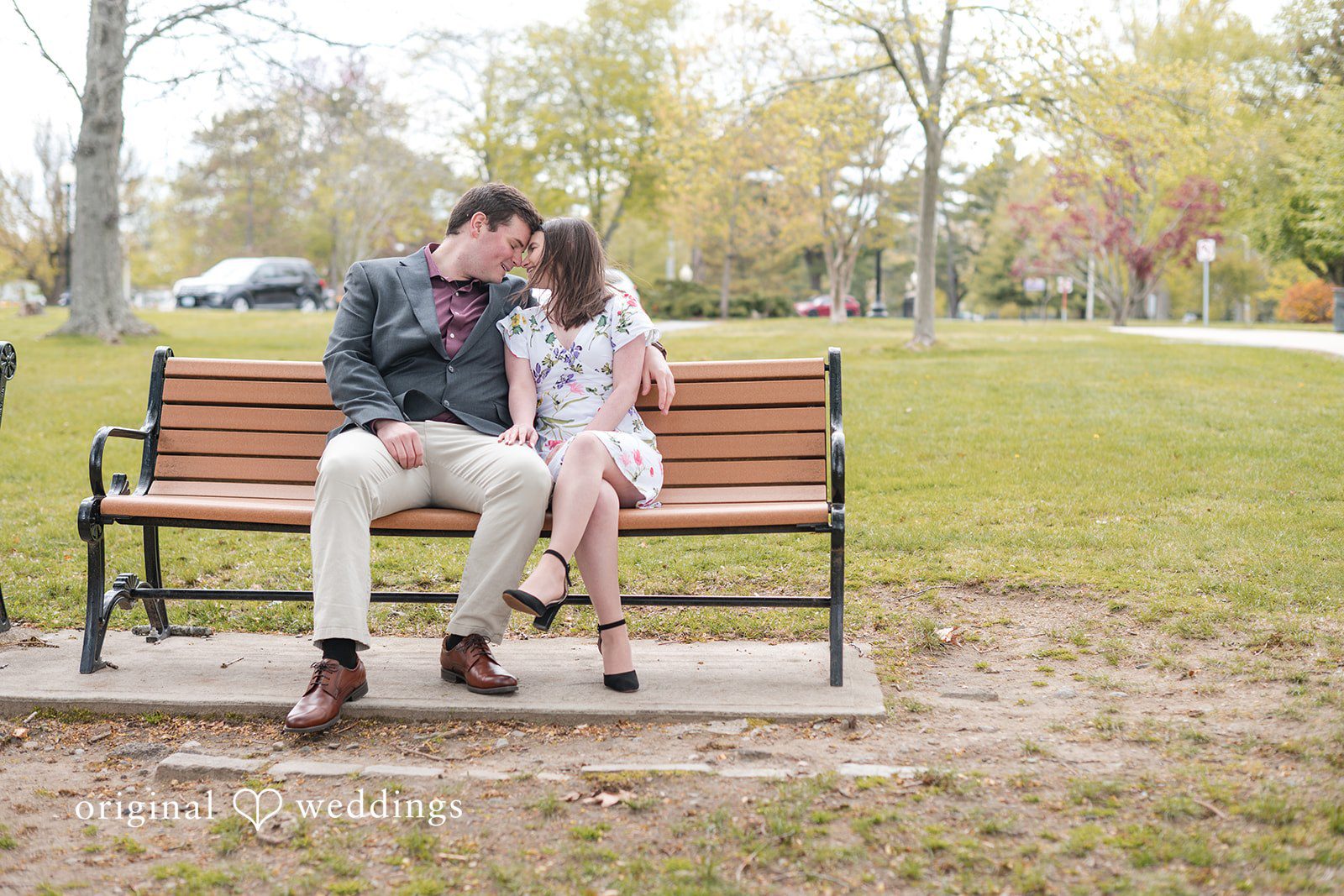 Couple close-up while sitting on bench at Roger Williams Park