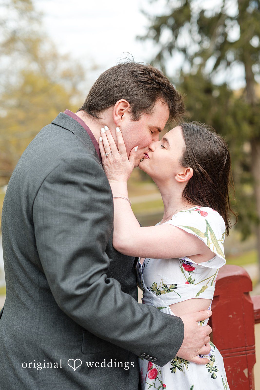 Couple sharing romantic kiss at Roger Williams Park