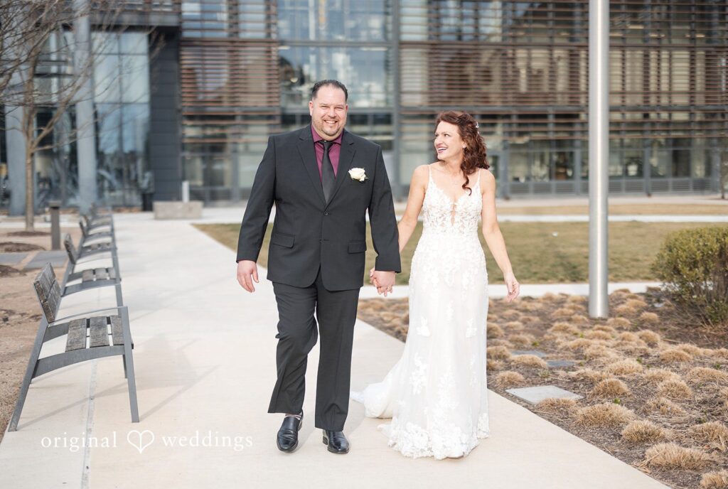 Baltimore wedding photographers capturing bride and groom walking together outdoor at Rye Street Tavern by Original Weddings