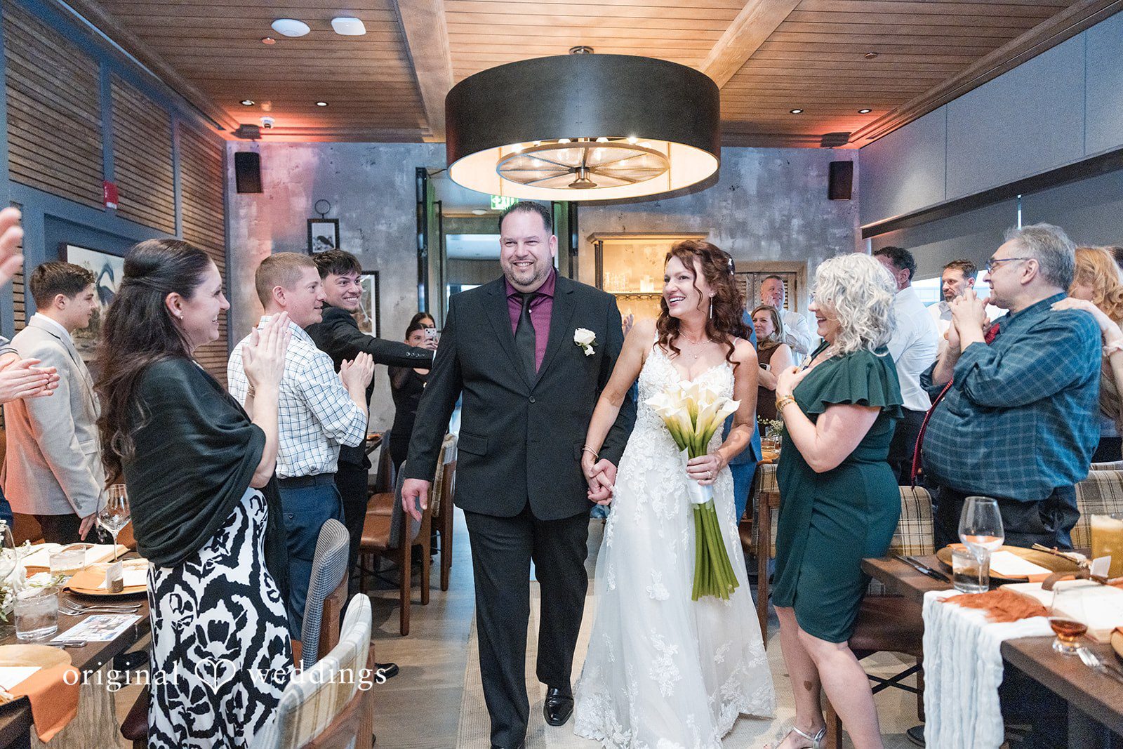 Baltimore Wedding Photographers capturing couple reception entrance at Rye Street Tavern by Original Weddings