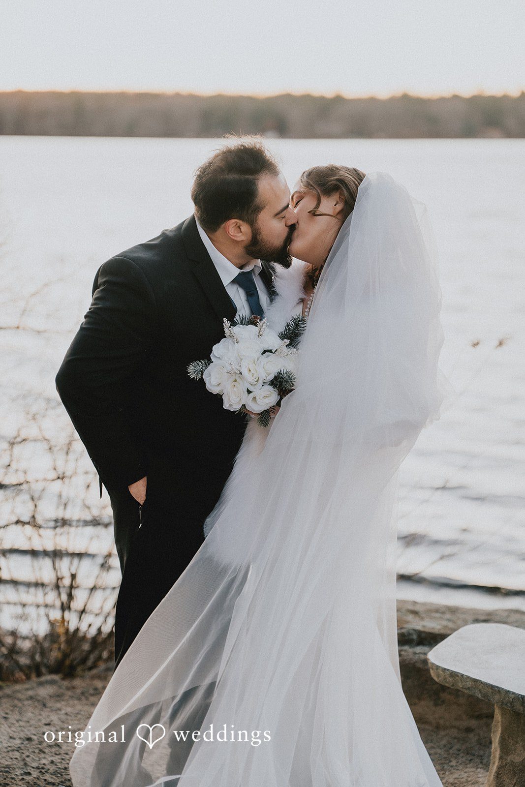 Mary + Ryan Romantic kiss moment of couple across the beautiful view