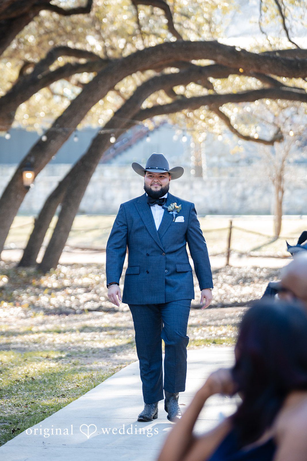Groom walking down the aisle