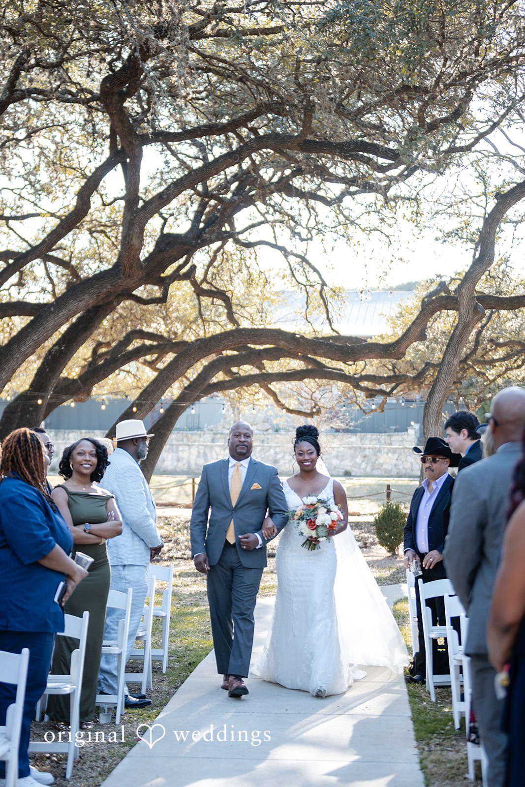 Bride walking down the aisle with someone