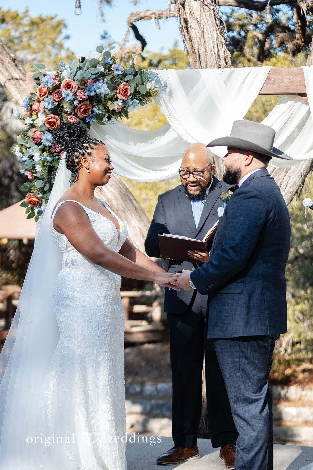 Couple standing hands in hands for ceremony