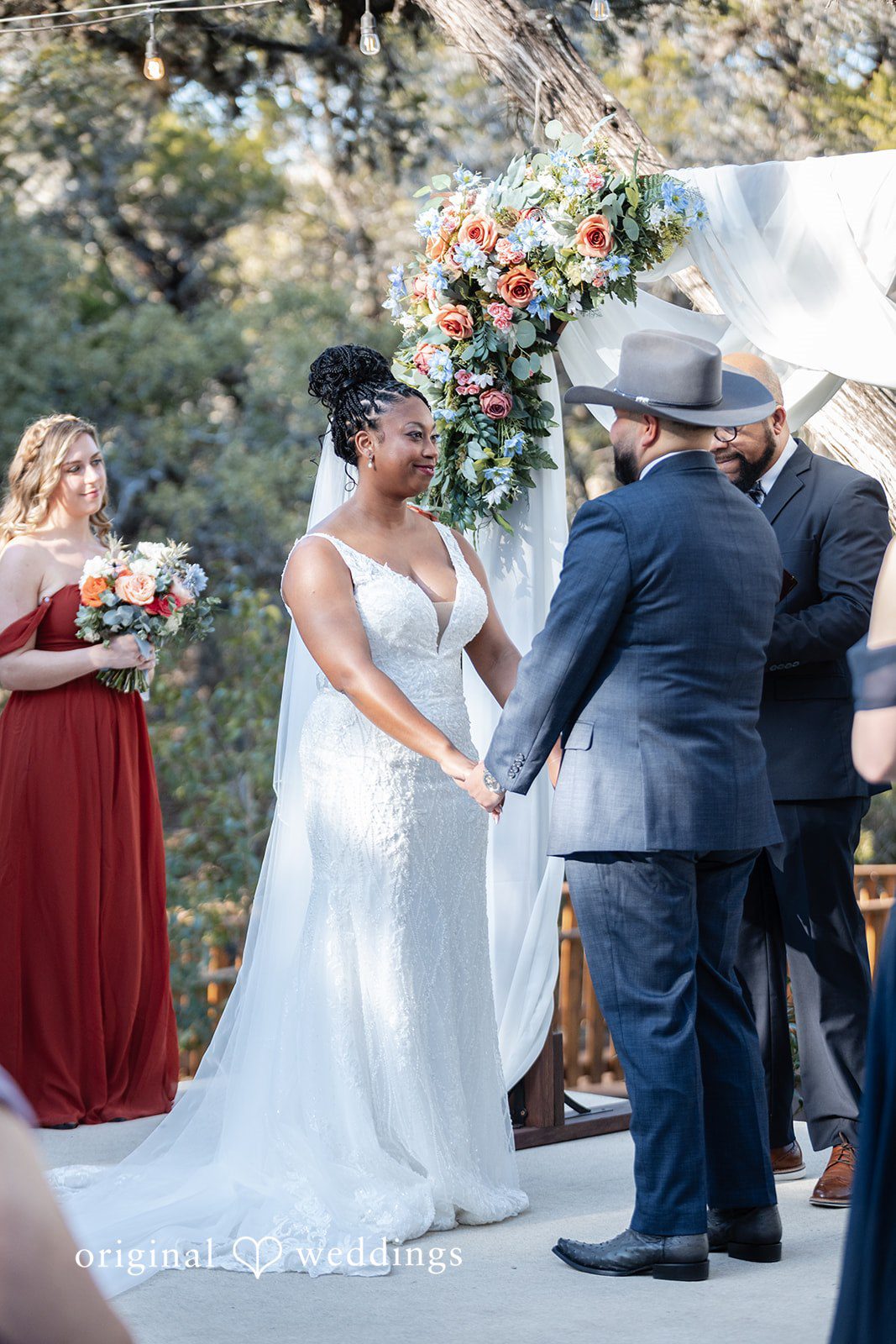 Couple standing hands in hands for ceremony at Scenic Springs by Wedgewood Weddings