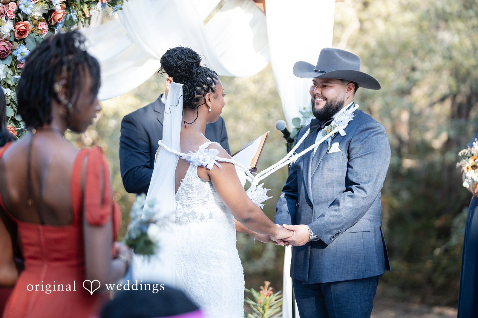 Groom and bride exchanging vows during ceremony at Scenic Springs by Wedgewood Weddings