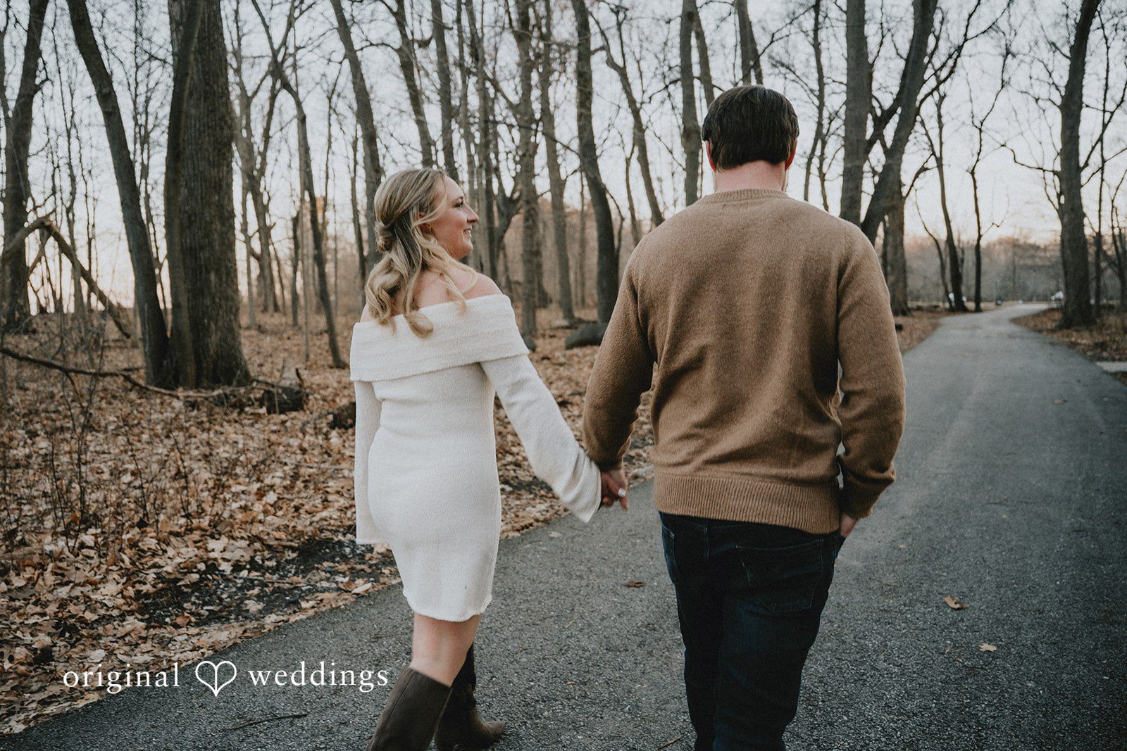 The couple walking hand-in-hand away at Seven Bridges.