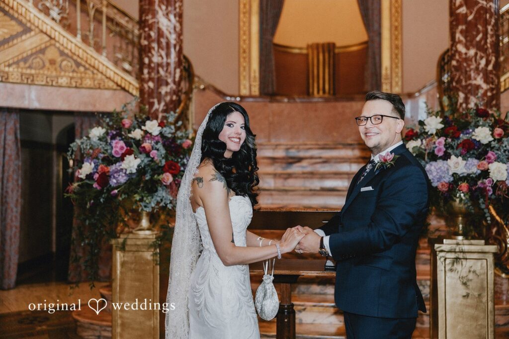 Daniel + Erica Newlyweds holding hands after exchanging vows