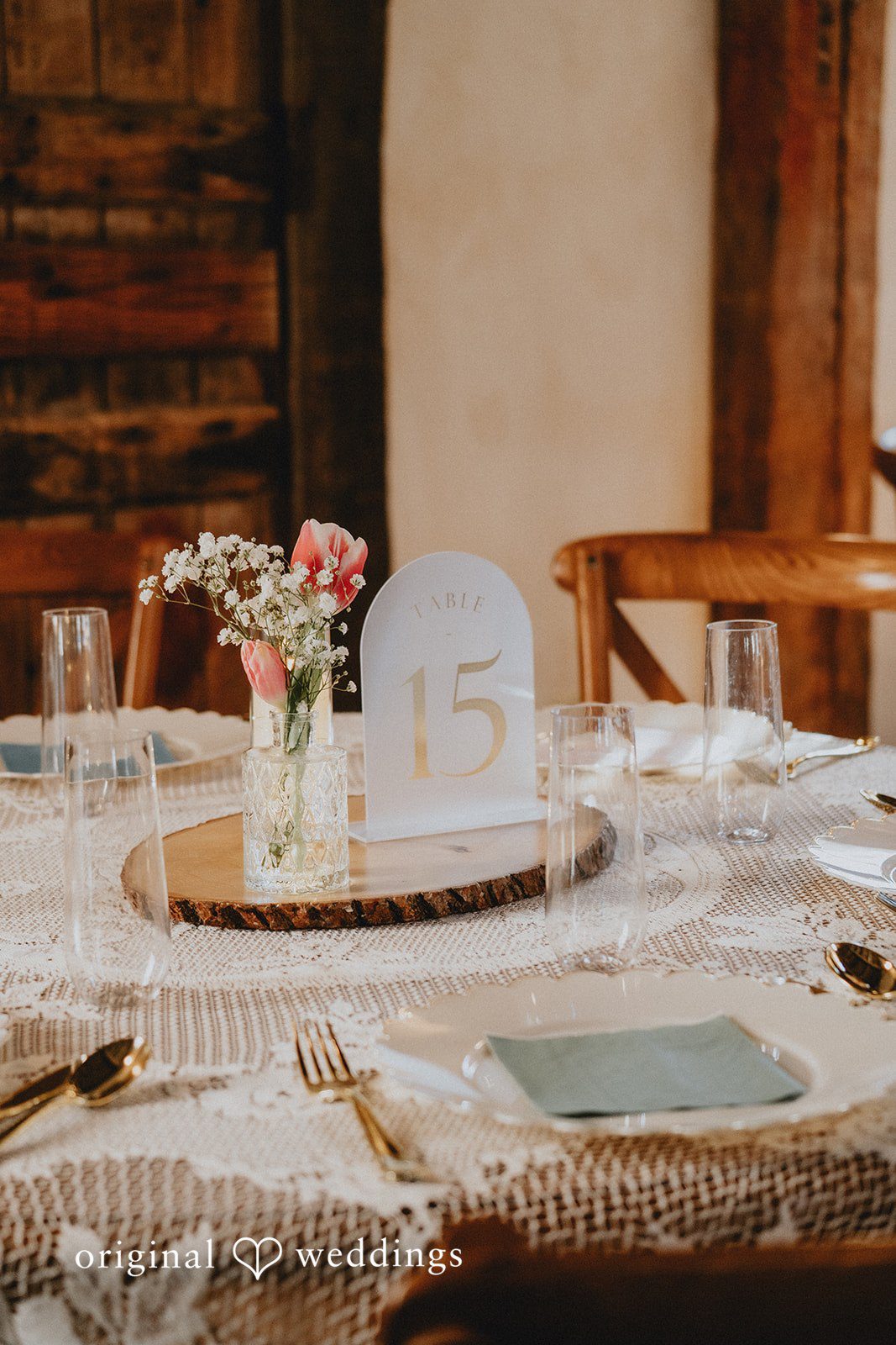 Reception dining setup featuring elegant table decor and floral arrangements
