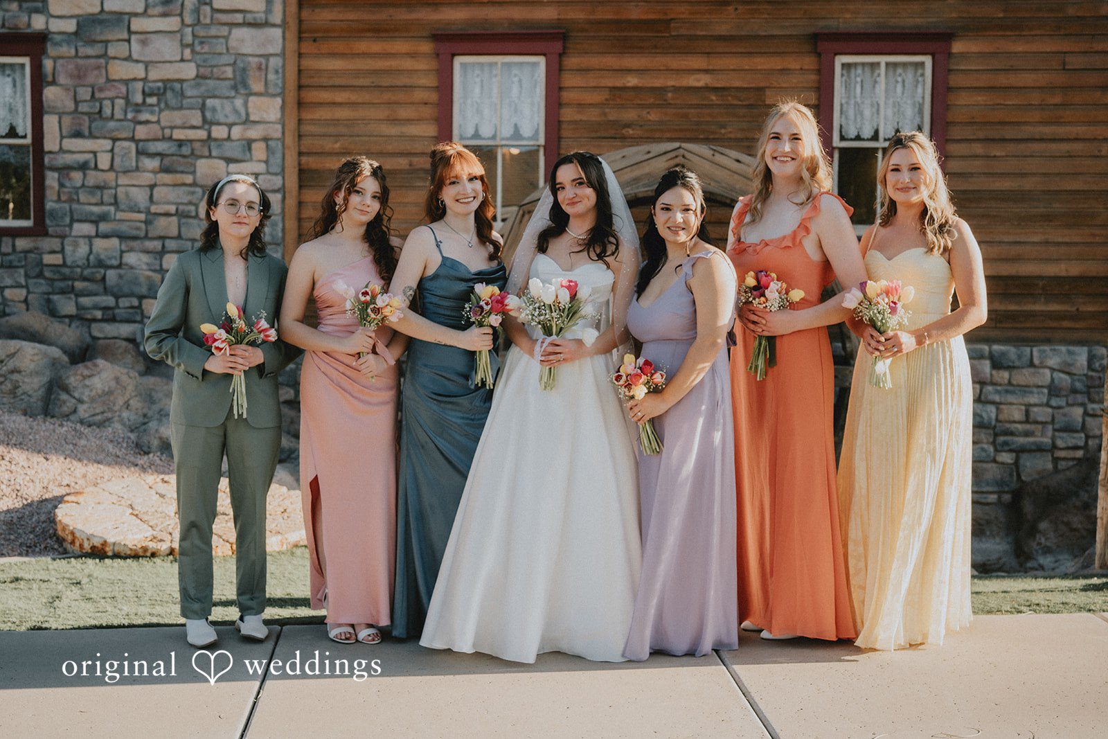 Bride posing with bridesmaids before ceremony at Shenandoah Mill