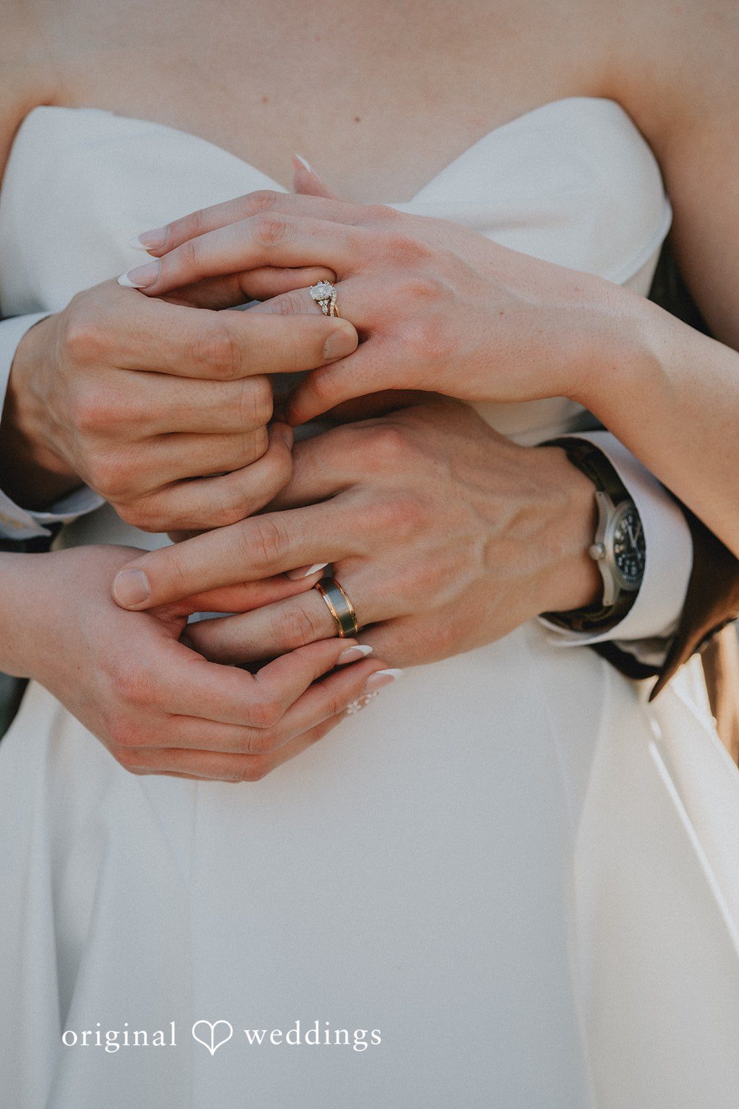 Close up detail shot of the bride and groom’s wedding rings